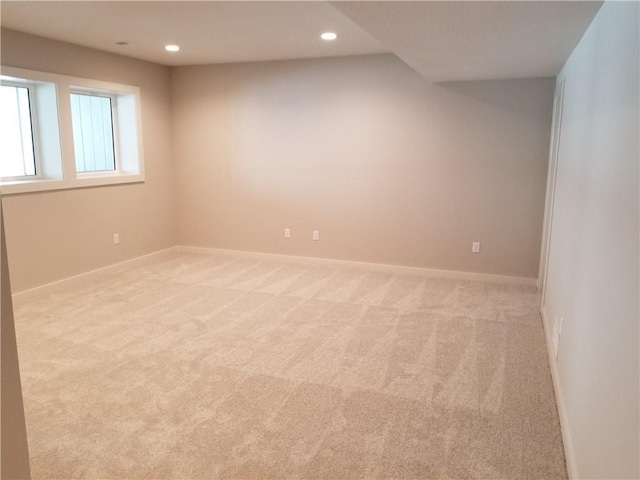 empty room featuring baseboards, carpet, and recessed lighting