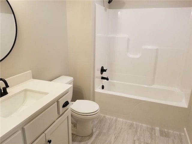 bathroom featuring shower / washtub combination, vanity, and toilet