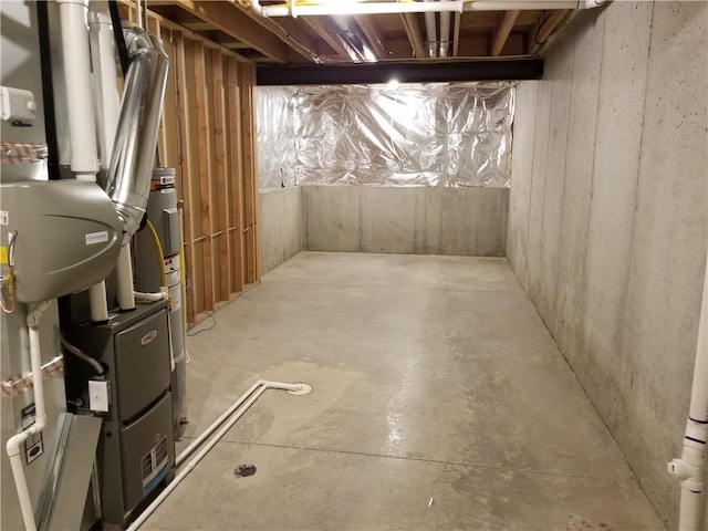 unfinished basement with water heater