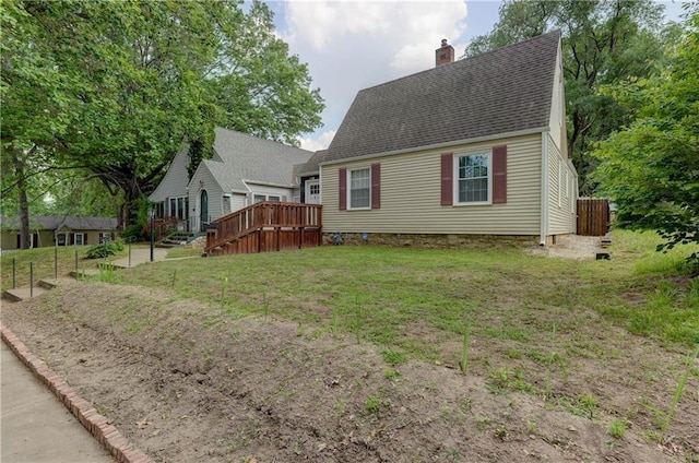 view of front of home with a front lawn and a deck