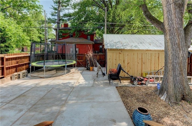 view of patio featuring a shed and a trampoline