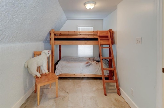 bedroom with vaulted ceiling