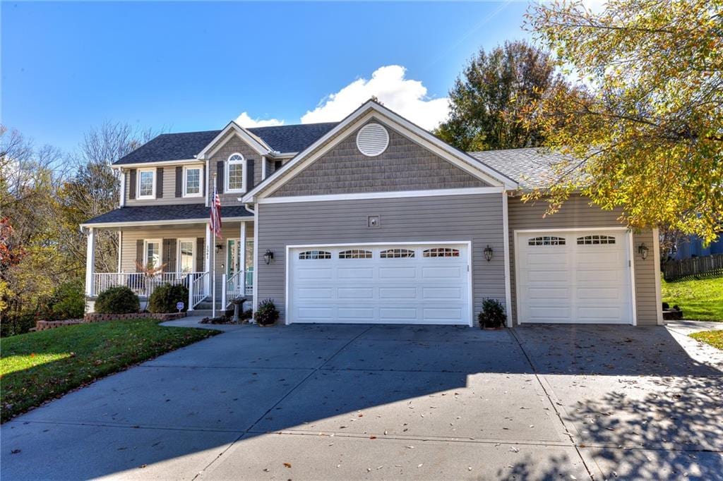 view of front of house featuring a garage and a porch