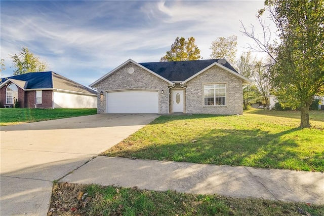 single story home featuring a garage and a front yard