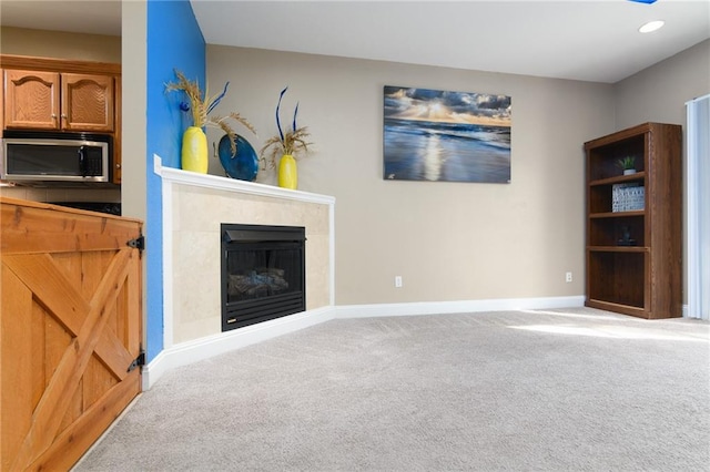 carpeted living room featuring a fireplace