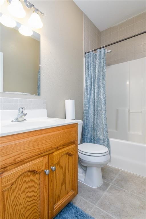 full bathroom featuring tile patterned flooring, vanity, shower / bath combo, and toilet