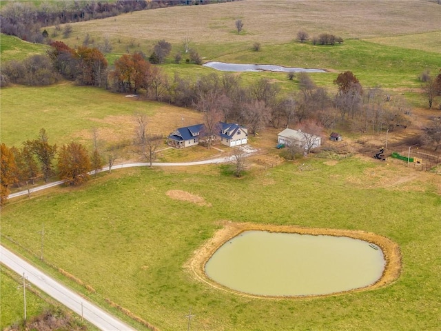 birds eye view of property with a rural view