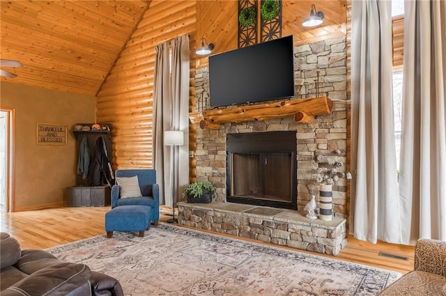 unfurnished living room featuring hardwood / wood-style floors, wooden ceiling, and high vaulted ceiling