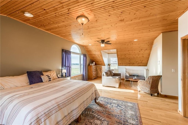 bedroom featuring light hardwood / wood-style flooring, wooden ceiling, and lofted ceiling