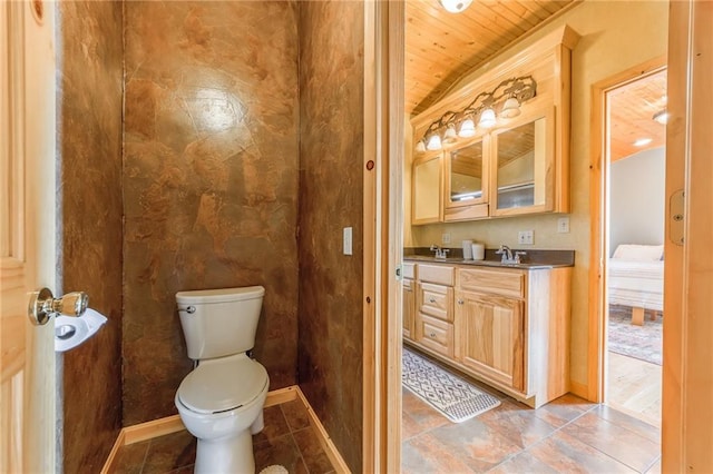 bathroom with vanity, toilet, and wooden ceiling