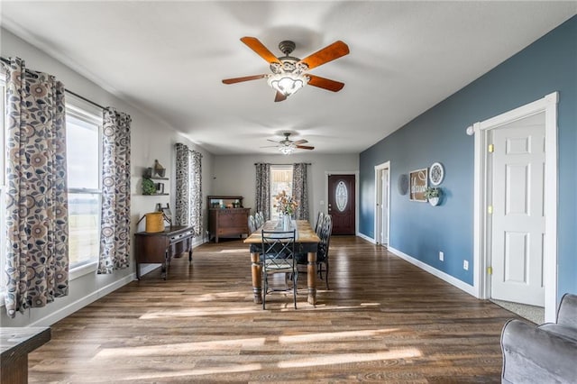 dining area featuring ceiling fan and dark hardwood / wood-style flooring