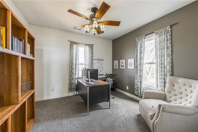 carpeted home office featuring ceiling fan and a wealth of natural light