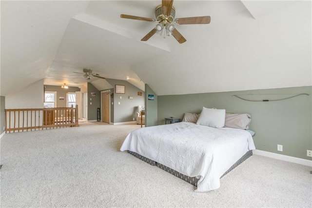 carpeted bedroom with ceiling fan and lofted ceiling