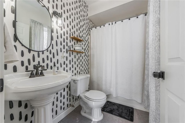 bathroom featuring tile patterned floors, shower / tub combo with curtain, and toilet