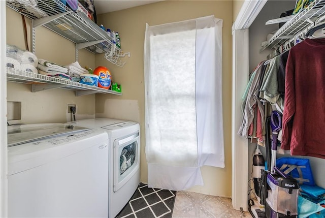 washroom with independent washer and dryer