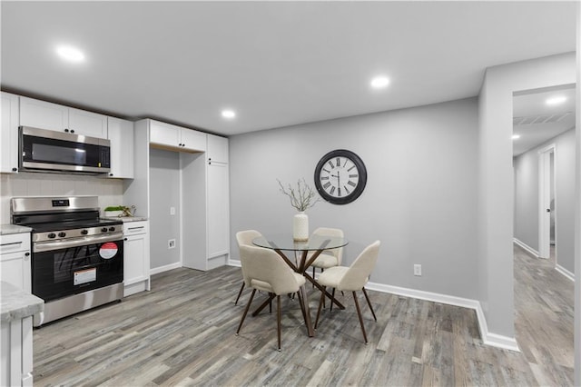 dining room featuring light hardwood / wood-style flooring