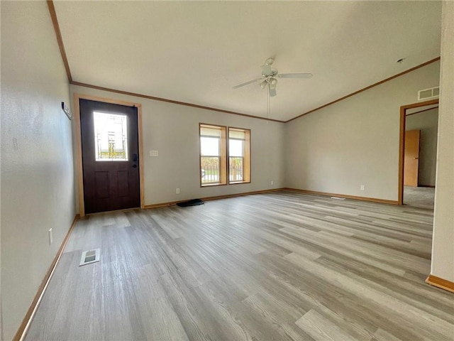 foyer featuring light hardwood / wood-style flooring, ceiling fan, and a healthy amount of sunlight