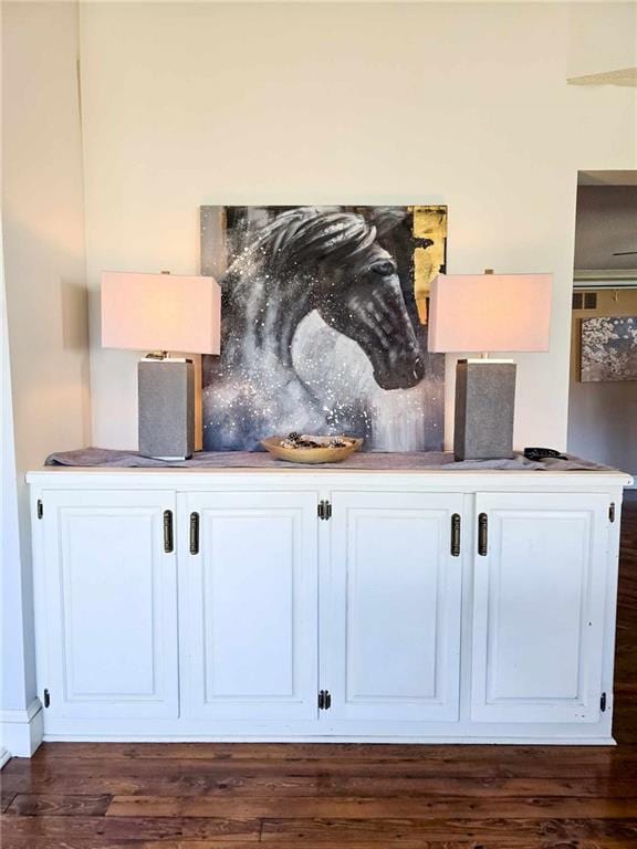 room details with decorative backsplash and wood finished floors