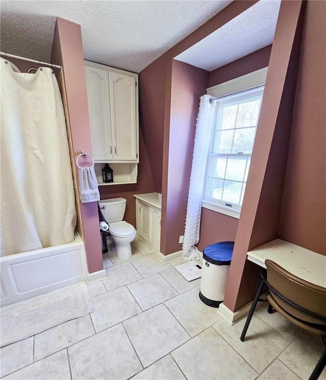 bathroom featuring toilet, a textured ceiling, shower / bath combination with curtain, baseboards, and tile patterned flooring