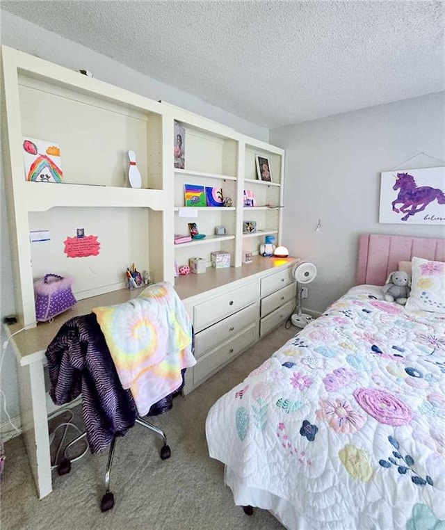 bedroom featuring carpet floors and a textured ceiling