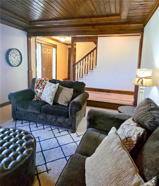 living area with crown molding, stairway, wood ceiling, and baseboards