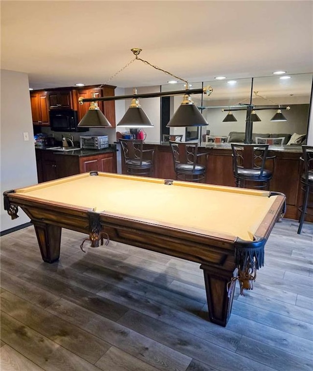 rec room with baseboards, wood finished floors, billiards, and a toaster