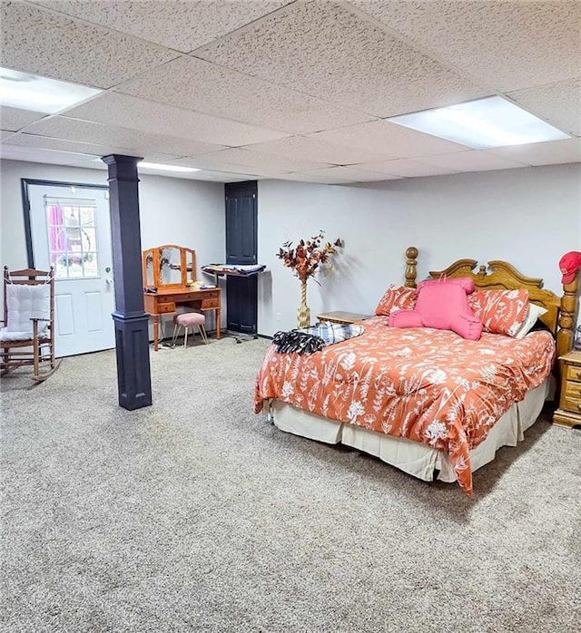 carpeted bedroom featuring a paneled ceiling