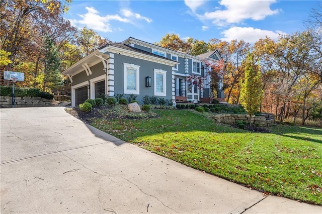 view of front facade featuring an attached garage, driveway, a front lawn, and stucco siding