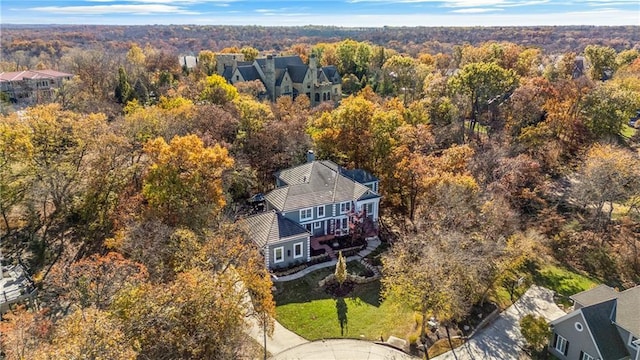 drone / aerial view featuring a forest view