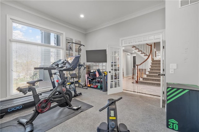 exercise room featuring visible vents, carpet flooring, crown molding, and french doors