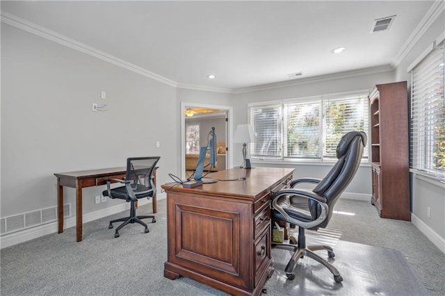 office area featuring light colored carpet, visible vents, crown molding, and baseboards