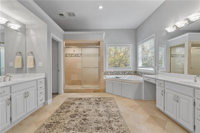 full bathroom with a garden tub, a shower stall, visible vents, and a sink