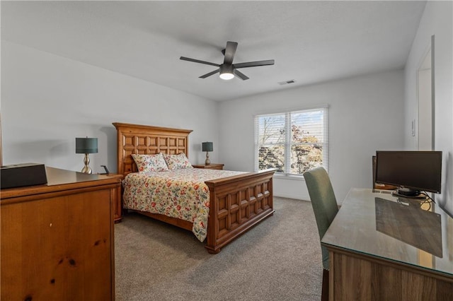 bedroom featuring a ceiling fan, visible vents, and carpet flooring