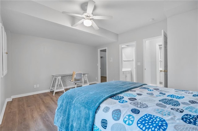 bedroom with ensuite bathroom, ceiling fan, baseboards, and wood finished floors