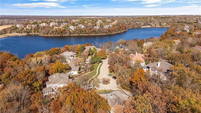 aerial view featuring a water view and a wooded view