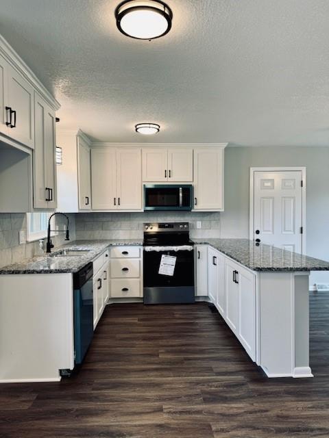 kitchen with stone counters, sink, stainless steel appliances, white cabinets, and dark hardwood / wood-style floors