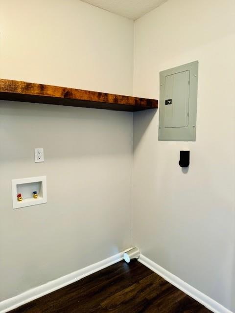 laundry room with electric panel, wood-type flooring, and washer hookup