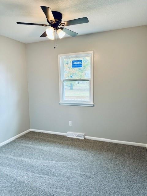 carpeted empty room with ceiling fan