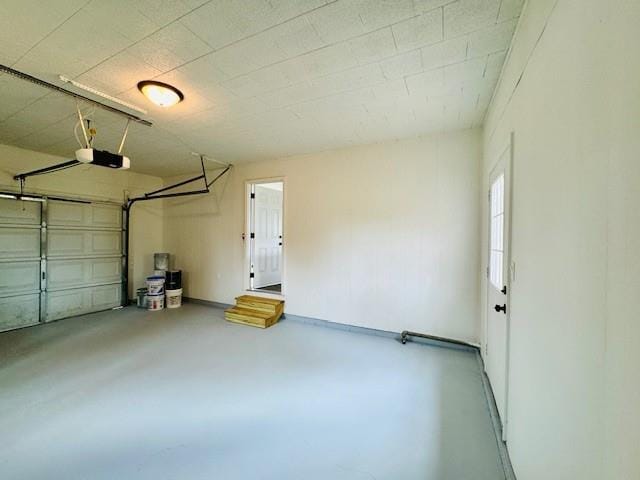 garage featuring a garage door opener