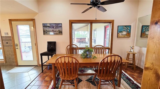 dining area featuring tile patterned floors and ceiling fan