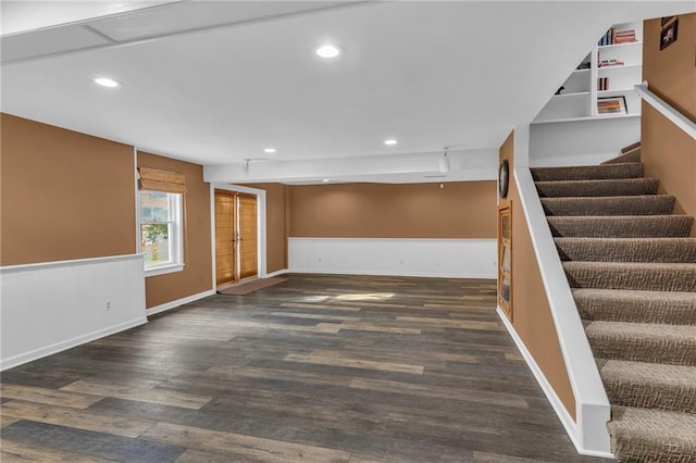 unfurnished living room with dark hardwood / wood-style floors