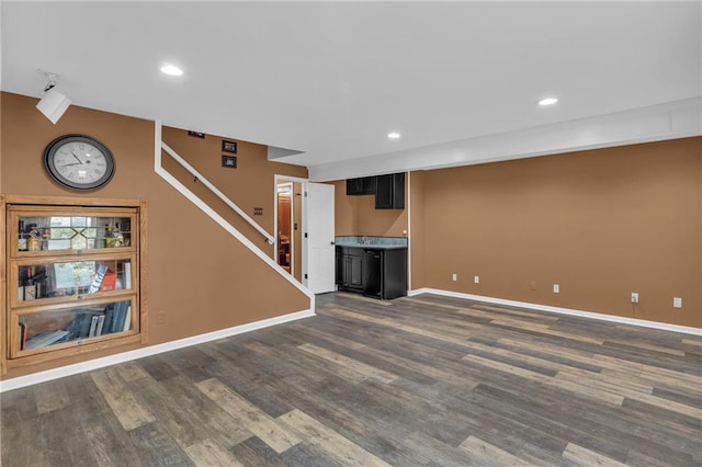 unfurnished living room with dark hardwood / wood-style flooring