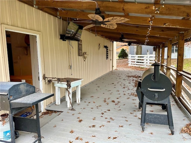 view of patio / terrace featuring ceiling fan, a grill, and a deck