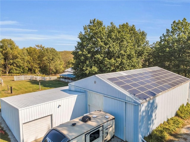 view of outbuilding featuring a yard and a garage