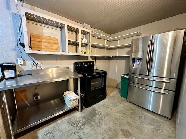 kitchen with stainless steel fridge, black / electric stove, and stainless steel counters