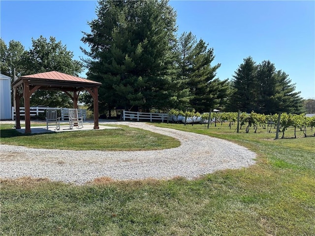 view of property's community with a gazebo and a lawn