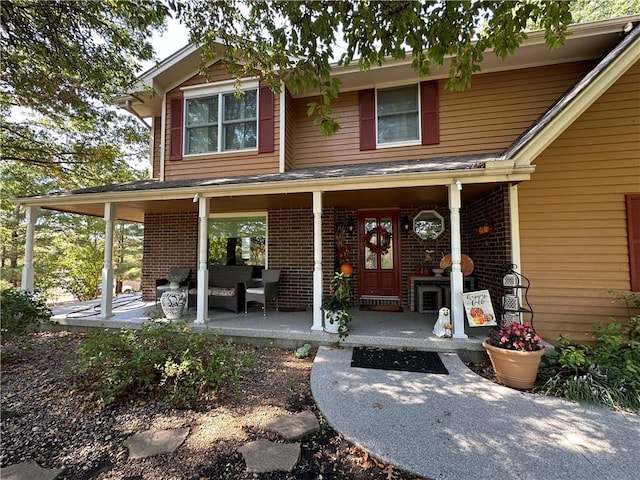 property entrance with covered porch