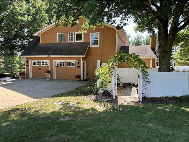 exterior space with a garage and a front lawn