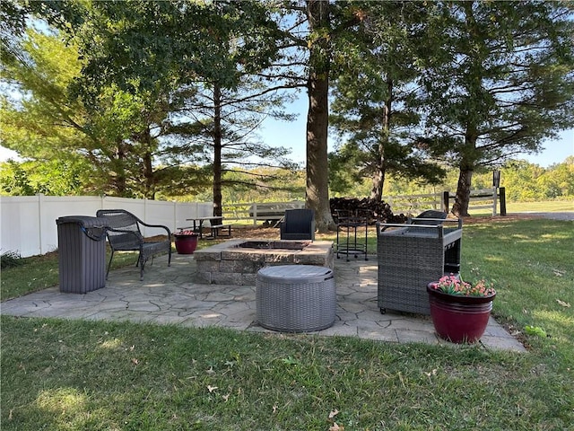 view of yard with a fire pit and a patio area