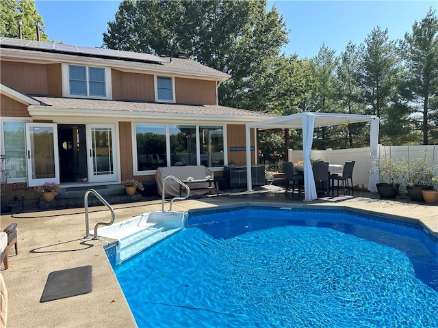 view of pool featuring an outdoor living space and a patio